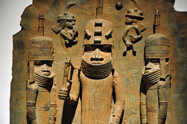The two small figures on top represent Portuguese with their long hair and helmets, Benin, Nigeria, 16th C.