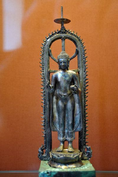 The Buddha standing under a royal parasol, Sabas, 8th-9th C.