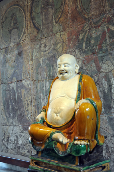 Stoneware figure of Budai, the fat smiling monnk, Henan Province, 1486