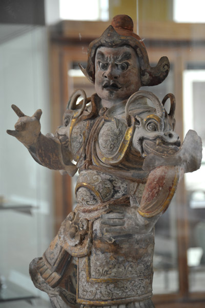 Painted pottery tomb guardian, Tang Dynasty, 7th-8th C. AD