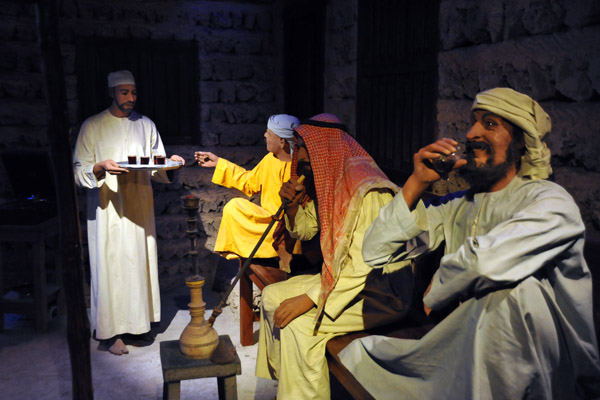Men relaxing with tea or Arabic coffee and shisha