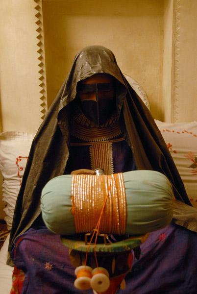 Woman embroidering, Dubai Museum