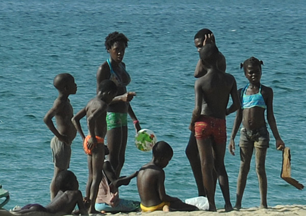 Angolans out on the beach, Ilha do Cabo