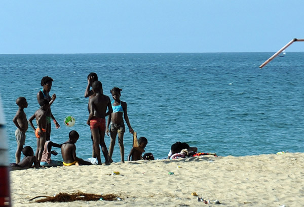 Angolans out on the beach, Ilha do Cabo