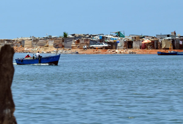 Lagoon and fishermen's village across from the Neto Mausoleum