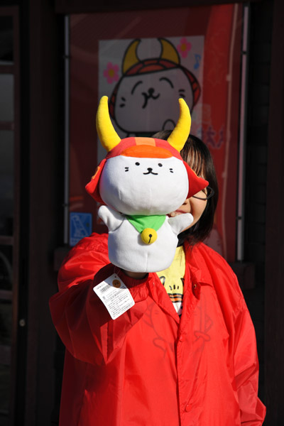 Japanese woman with a puppet of Hikone's mascot