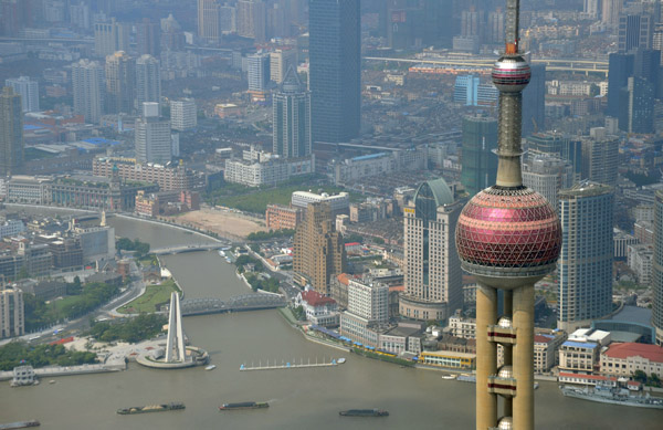 The top of the Orient Pearl TV Tower and the confluence of the Huangpu and Suzhou Rivers at the Monument to the People's Heroes