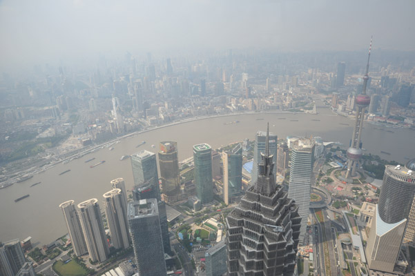 Looking over the top of the Jin Mao Tower and across the Huangpu River to the Bund, Shanghai
