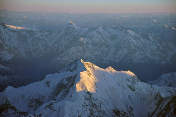 First rays of the morning sun on Rakaposhi, Pakistan Himalaya