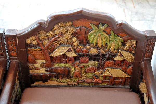 Carved and painted wooden chairs with a pastoral scene, Wat Saket