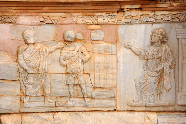 Sculptural relief panel in front of the stage