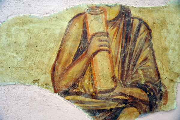 Frescoe fragment of a figure holding a scroll