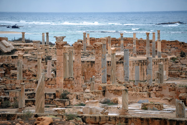 Ruins of Sabratha's forum overlooked by the Capitoleum, the Temple of Jupiter