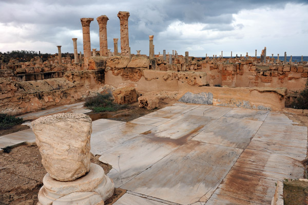 A section of floor paved with large marble slabs