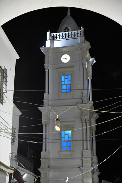Ottoman Clock Tower through arch at the north end of Souq Al Mushir