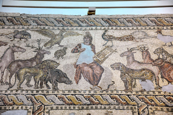 Mosaic of Orpheus playing music charming wild beasts