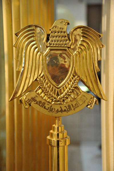 Golden staff topped with the Libyan Eagle