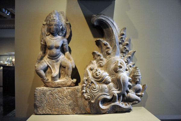 Mythical creature with a warrior in its mouth, a standing female figure and a worshipping celestial, Vietnam, 1075-1125