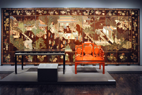 19th C. Qing Dynasty throne with a large table and lacquered wood screen Prosperity in an imperial palacedated 1670
