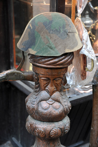 Metalwork in the shape of a man and a military helmet