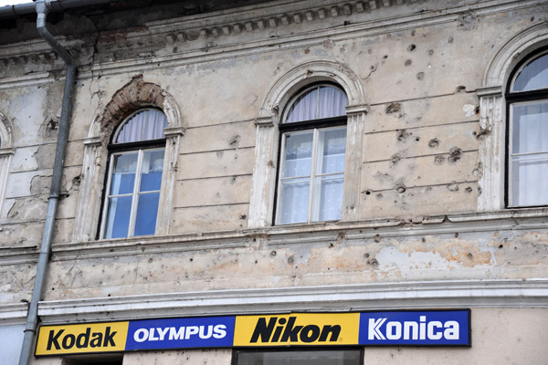 Battle damage still visible along main street, Konjic