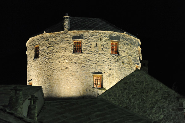 Semi-circular Halebija Tower at night, Mostar