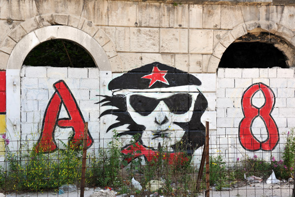 Graffiti on a walled up ruin along Mostar's Main Street