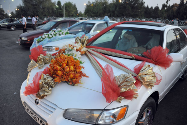 Vehicles decorated for wedding festivities, Mary