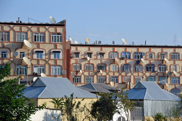 Satellite dishes abound on an old apartment block in Mary