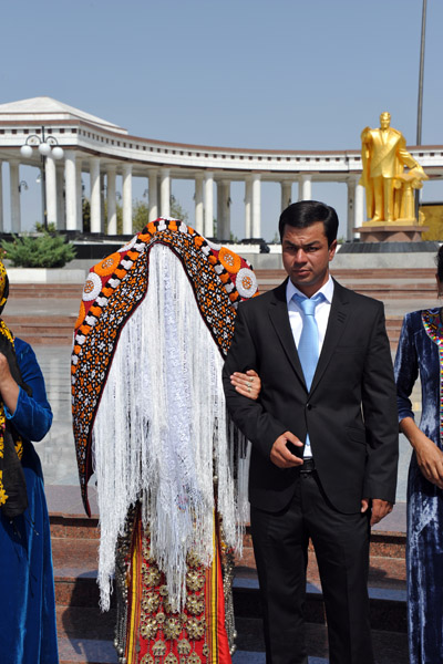 A second bride and groom arrive for photos