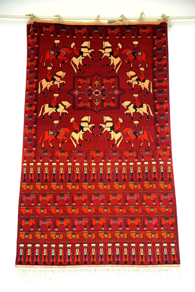 Turkmen carpet with horses and men