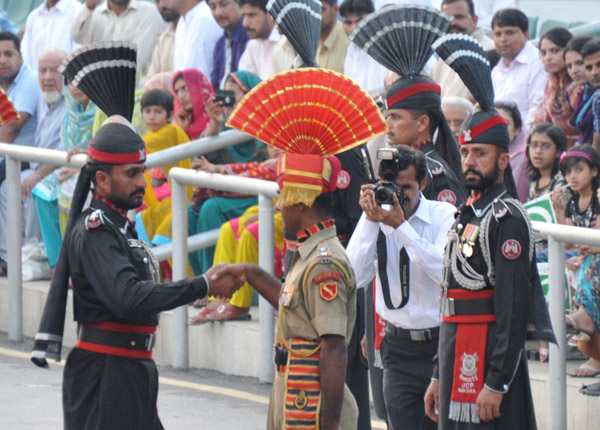 The handshake between the Indian and Pakistani commanders marks the end of the border ceremony