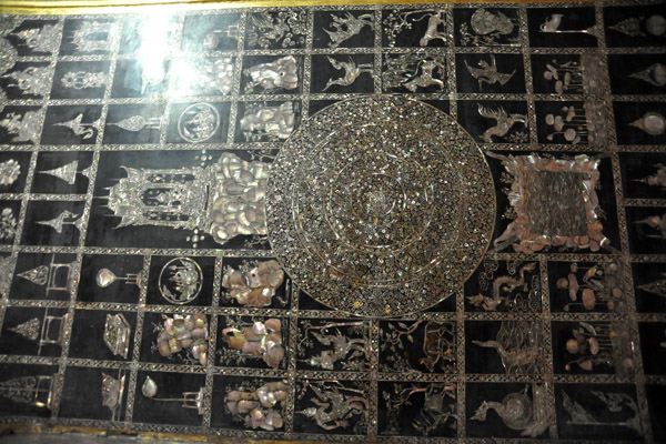 The soles of the feet contain 108 inlaid mother of pearl Buddha images