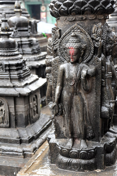Buddha statue among the small stupas of Swayambhunath