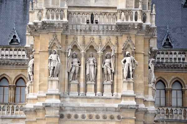 Façade sculptures beneath the main tower, Vienna City Hall