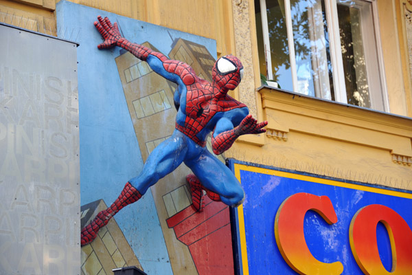 Spiderman hanging onto the wall at a comic shop in the Vienna Altstadt