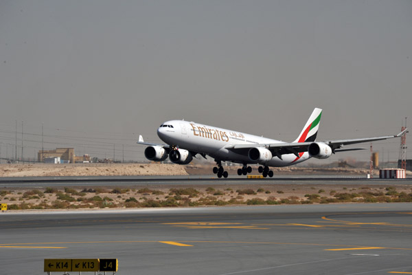 Emirates A340-500 landing during the afternoon pause in the Dubai Airshow