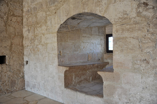 Niche with stone benches and a small window built into the thick walls of Kolossi Castle
