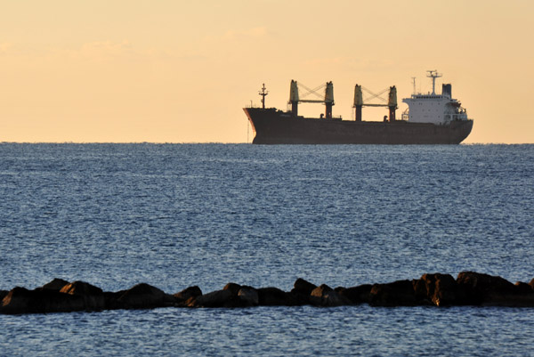 The freighter Asphodel (bulk carrier) sits on the horizon in the early morning calm off Limmasol