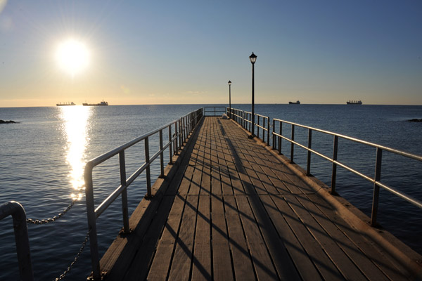 The winter sun low in the southeastern sky, Limassol pier