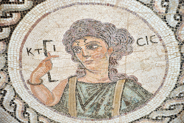 The woman in the mosaic is holding a measuring instrument equivalent to 1 Roman foot