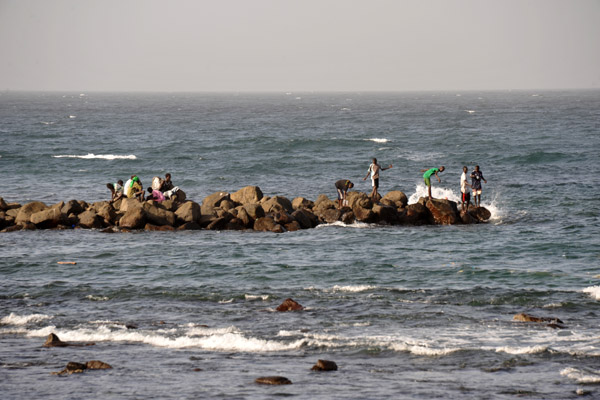Locals fishing off a breakwater, Cap-Verte
