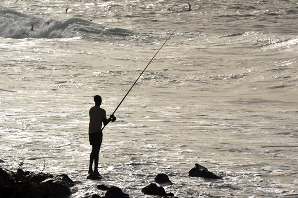 Silhouette of man fishing, Cap-Verte, Dakar, Senegal