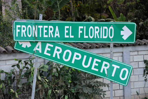 Roadsigns for the Guatemalan border and Copan Airport