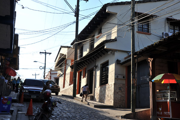 A hilly cobblestoned street in the old town, Copan Ruinas