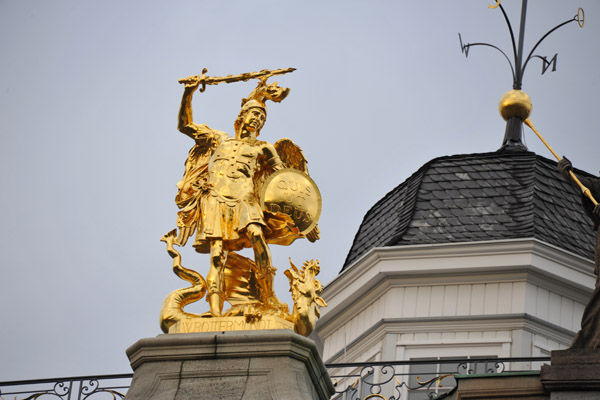 Copy of the statue of St. Michael in place of the original that is now inside the main building