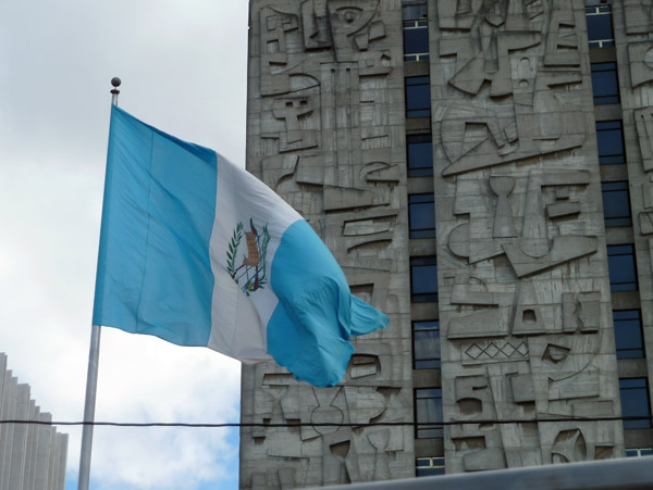 The flag of Guatemala in front of the Banco de Guatemala