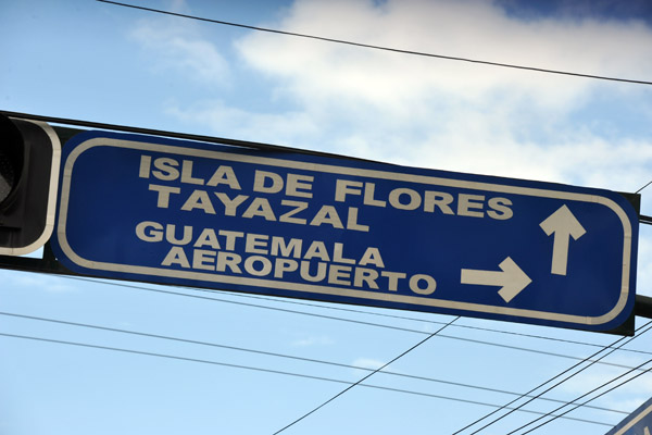 Road sign for the Isla de Flores, Guatemala City and Flores Airport