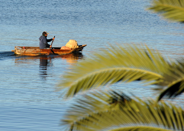Paddling a rickety looking looking canoe, Panajachel