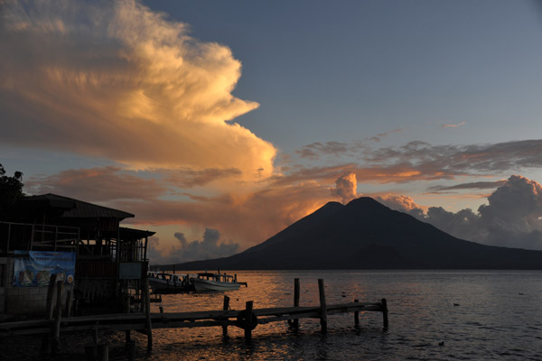 Atitlan's lake and volcanos as the clouds take on evening's colors